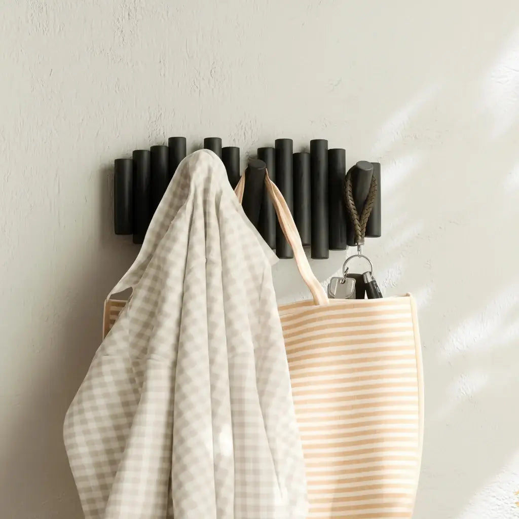 Wall-mounted coat rack with retractable pegs Retractable-1